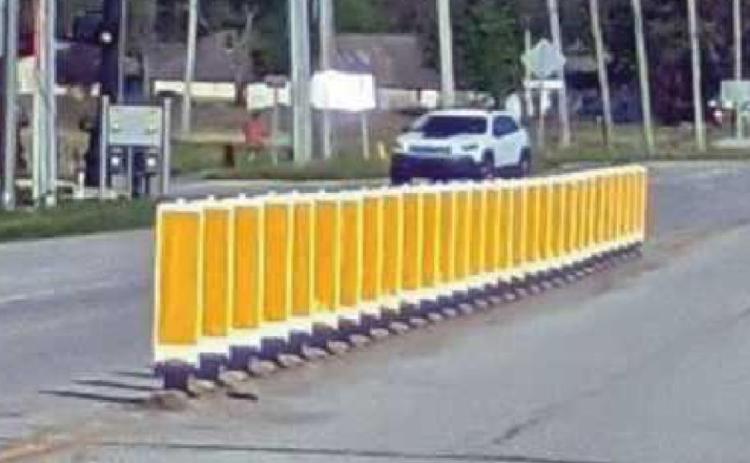 Above and below are barriers the trustees are considering to stop the back-up of traffic from U.S. Route 20 and Helen Drive making a left turn into Starbucks.